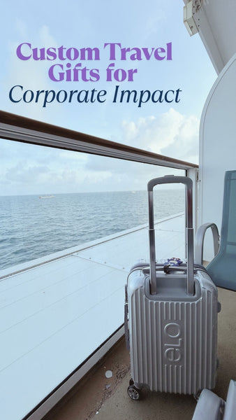 Silver hard-shell suitcase on a cruise ship balcony overlooking the ocean, ideal for travel gift inspiration