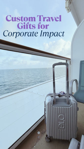 Silver hard-shell suitcase on a cruise ship balcony overlooking the ocean, ideal for travel gift inspiration